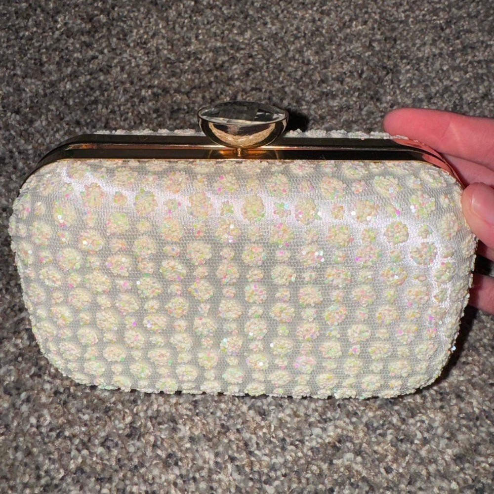 White sequin clutch bag with gold accents